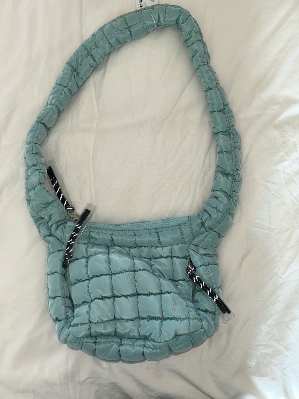 FP Movement Quilted Baby Carry All Sling Bag